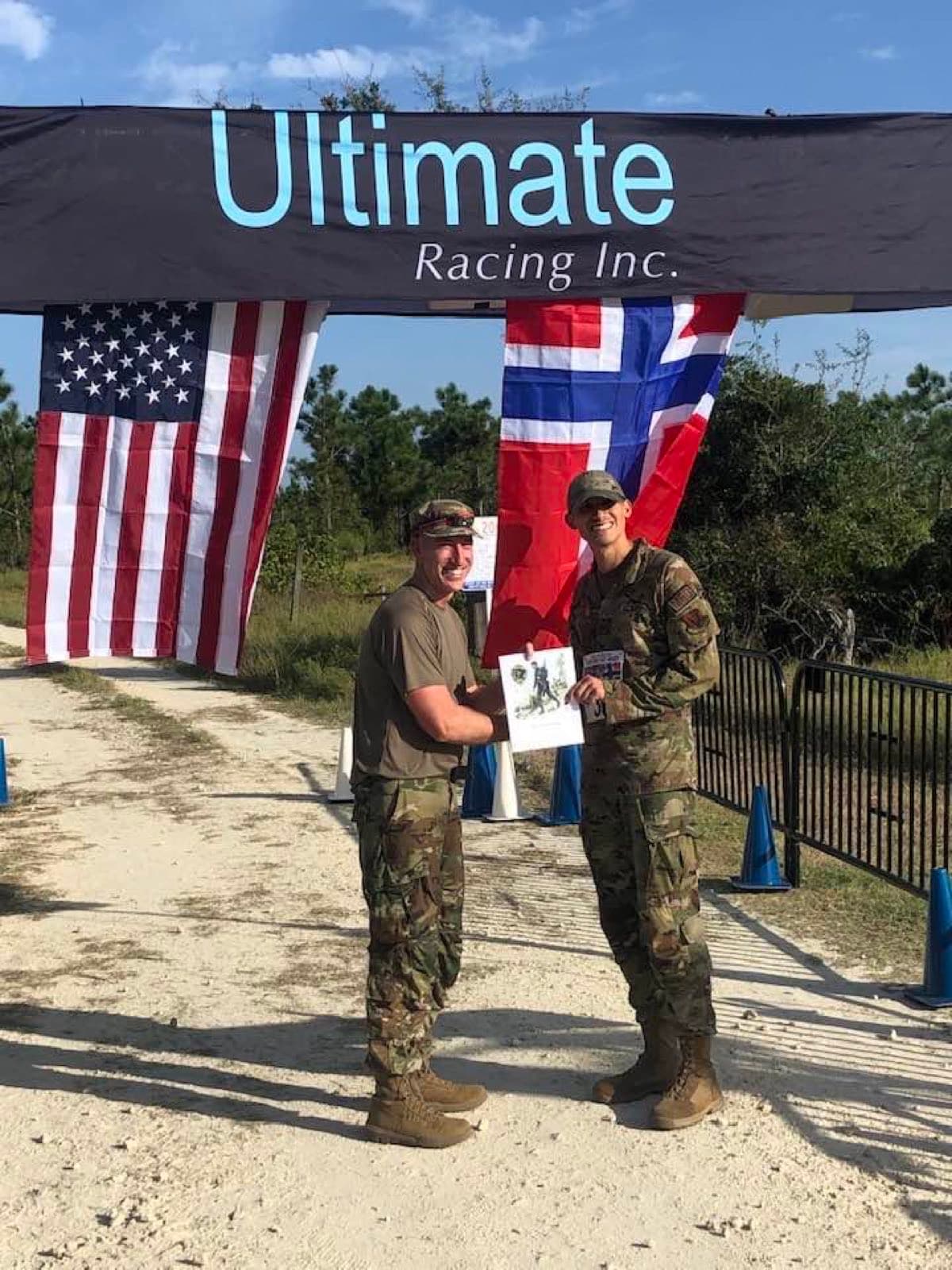 A runner receiving an award at a military race finish
