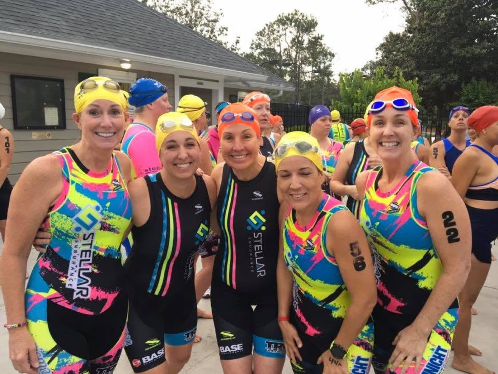 Swimmers smiling before a multisport race