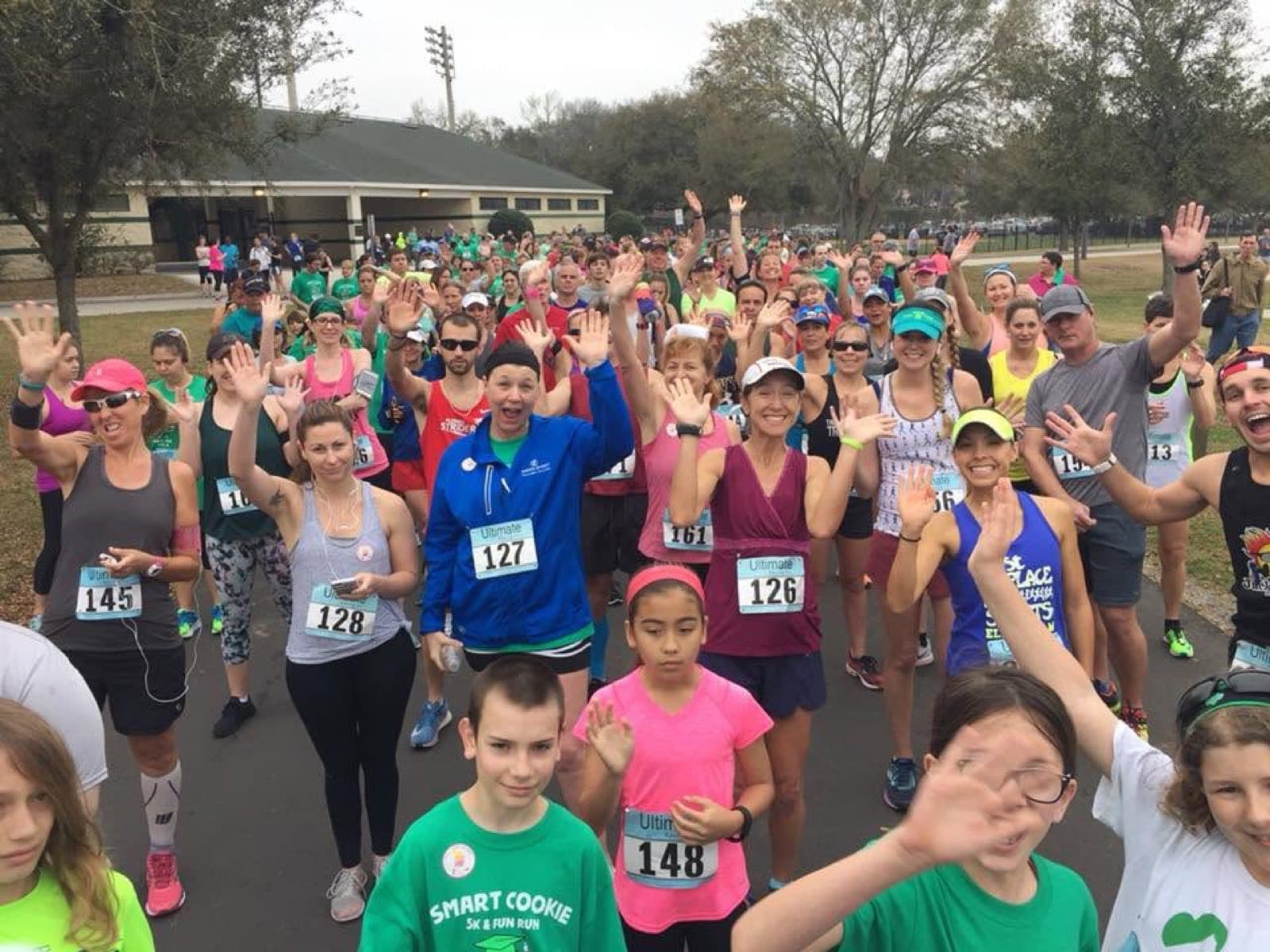 A group of runners gathered at a race start line