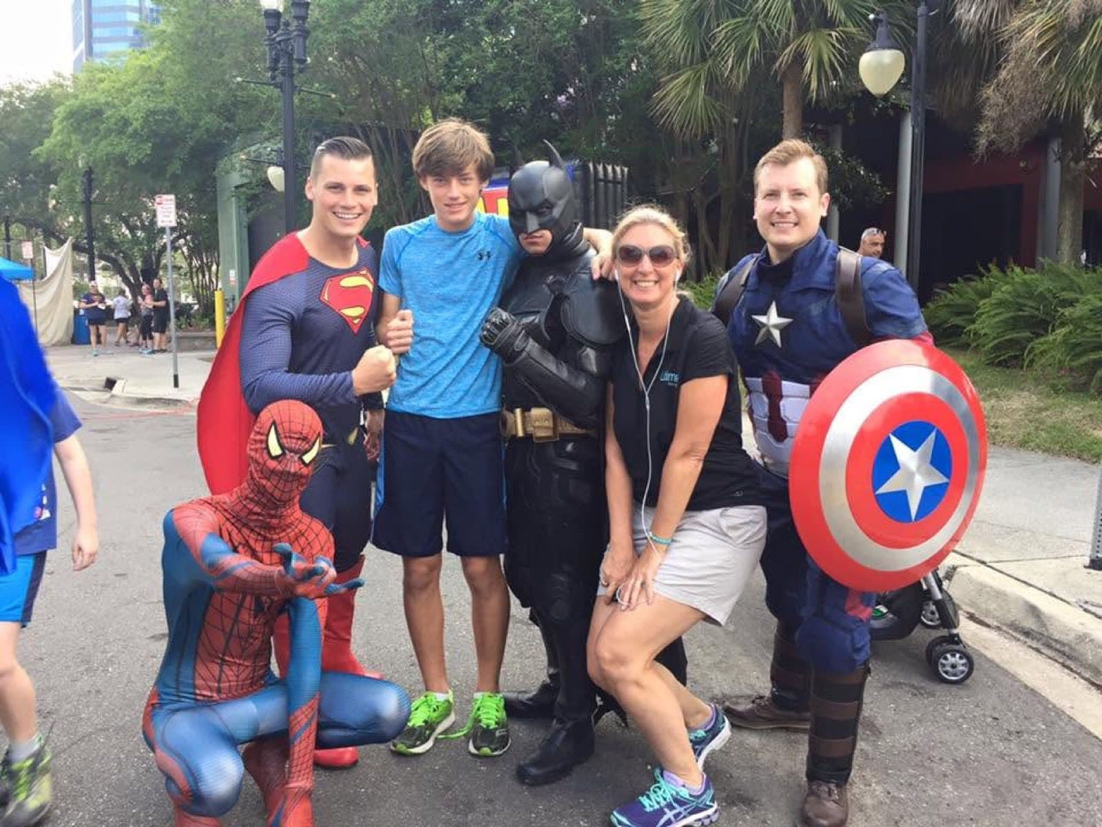 Participants dressed as superheroes at a themed run