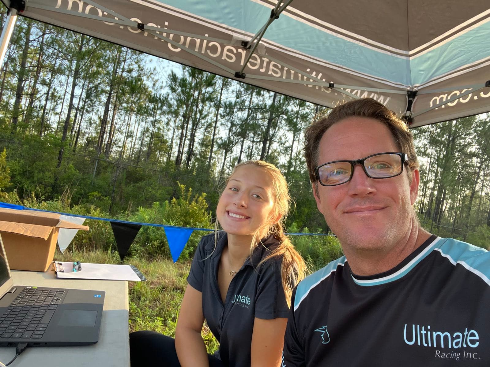 Meredith Palmieri and Sal Palmieri at the Ultimate Racing timing tent on race morning.